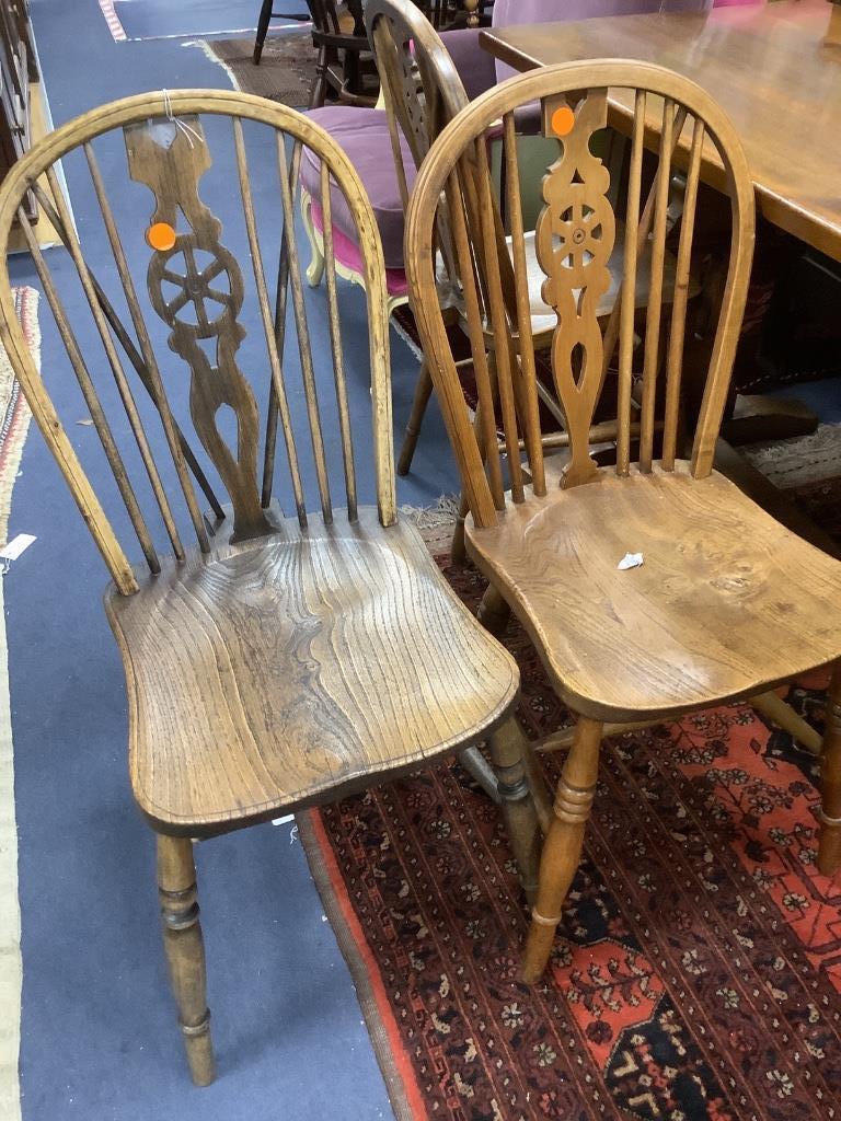 A modern kitchen refectory table, and three wheel back dining chairs (4)